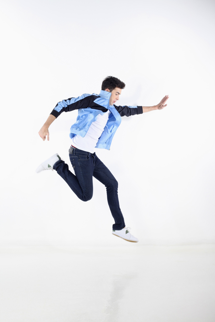 Man in blue jacket jumping